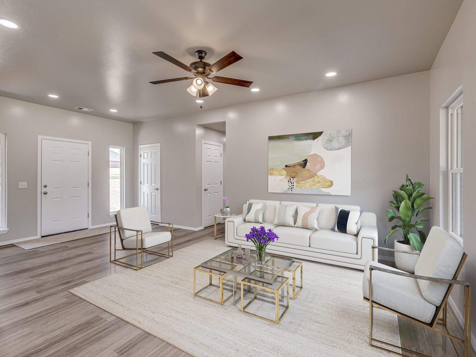 Bright finished living room with clean trim and flooring transitions
