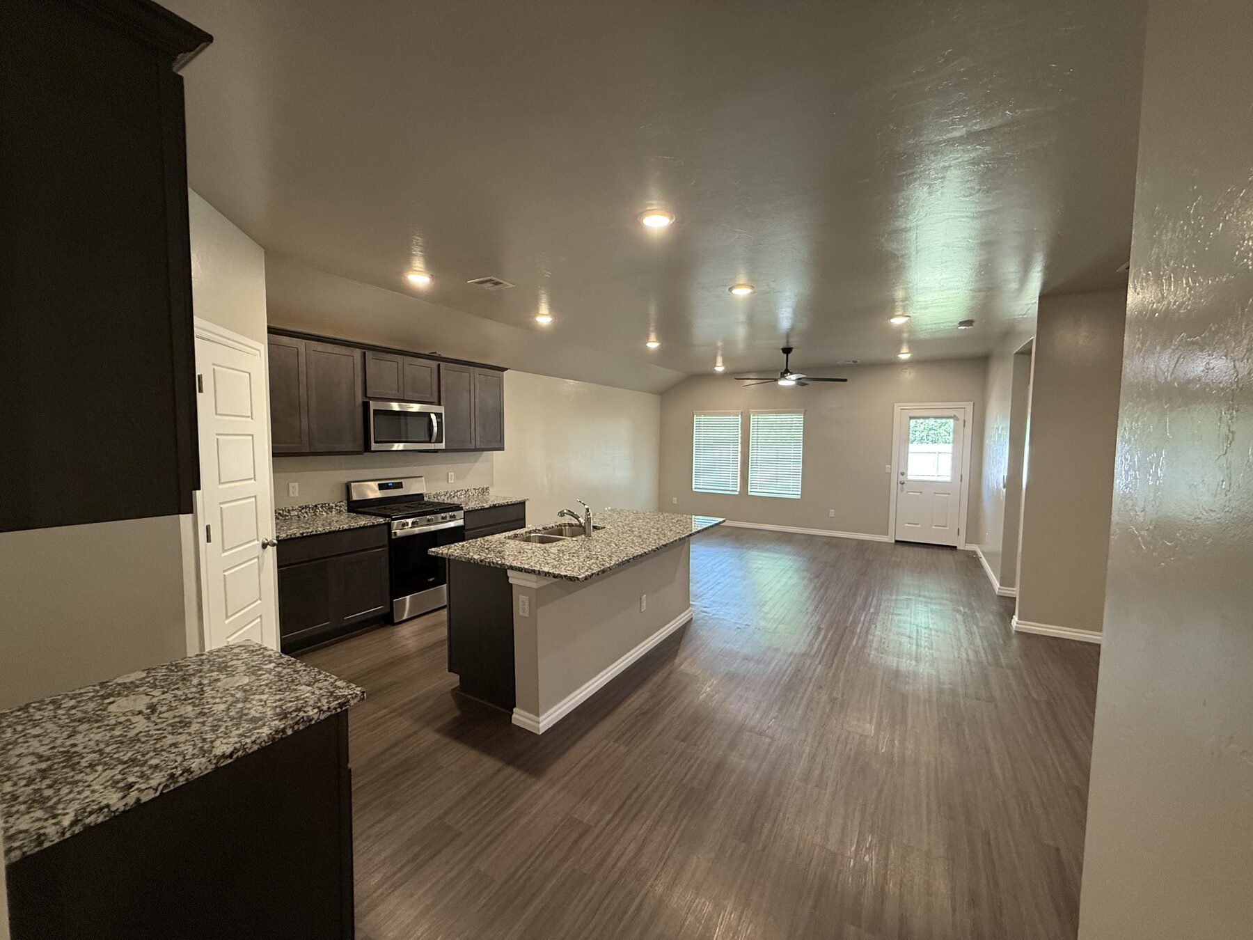 Open-concept kitchen with island and recessed lighting in the Oklahoma City metro