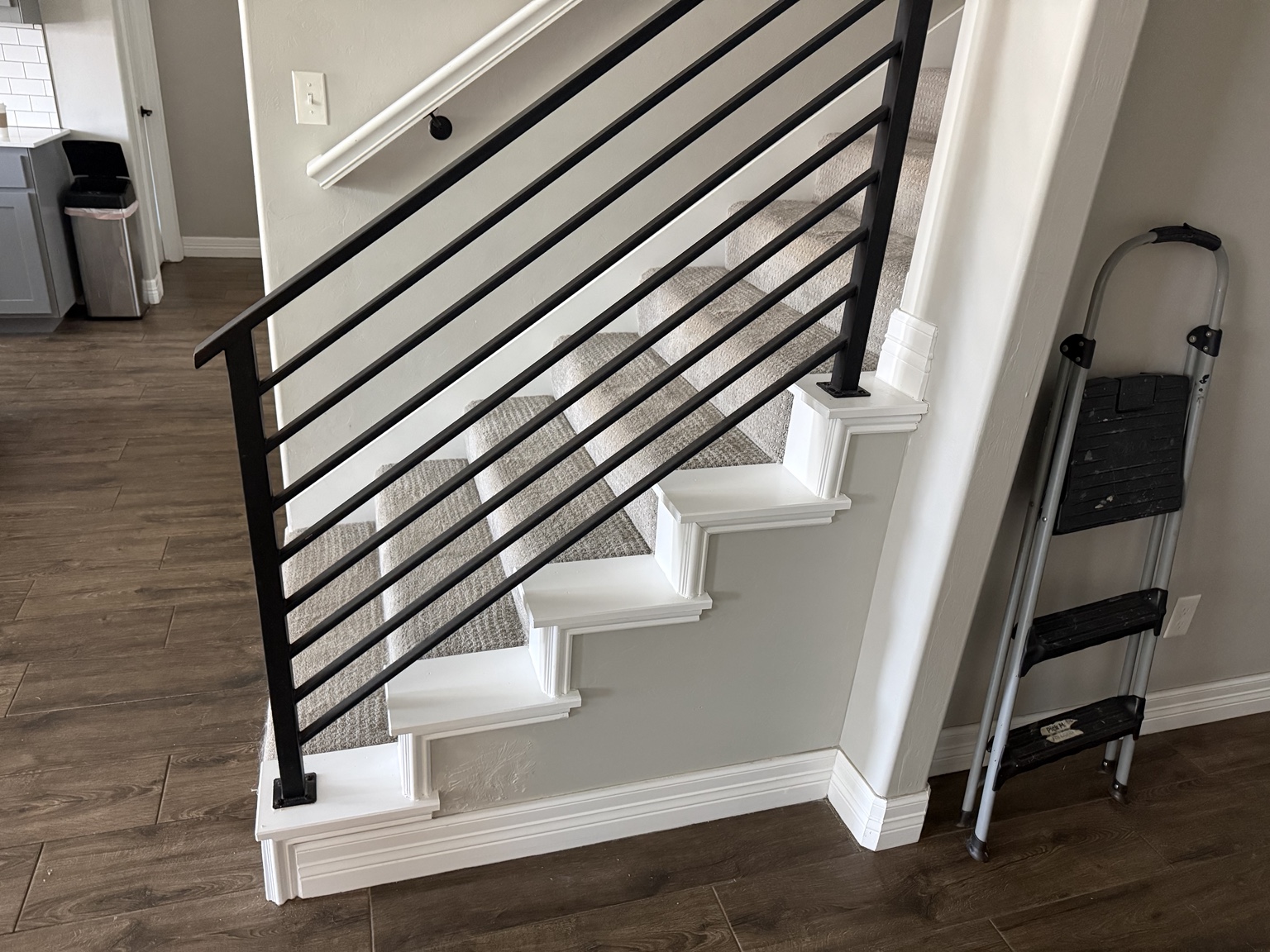 Stairway after trim repair and refinishing for home listing preparation